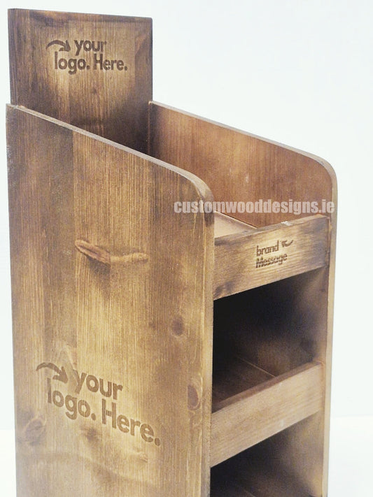 Dark pine three-shelf countertop display from Custom Wood Designs showing a compact wooden retail display with three shelves.