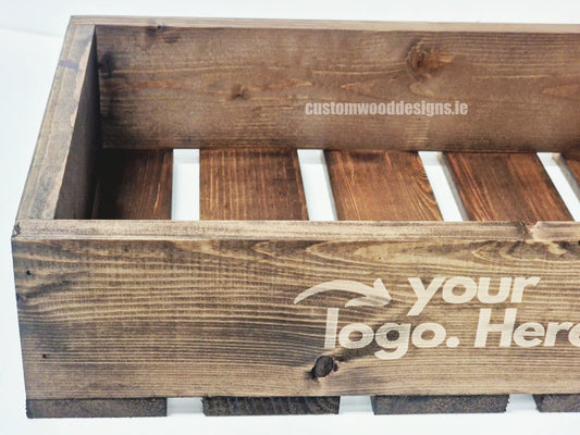 Dark pine crate-style countertop display by Custom Wood Designs, showcasing a rustic wooden crate for product presentation.