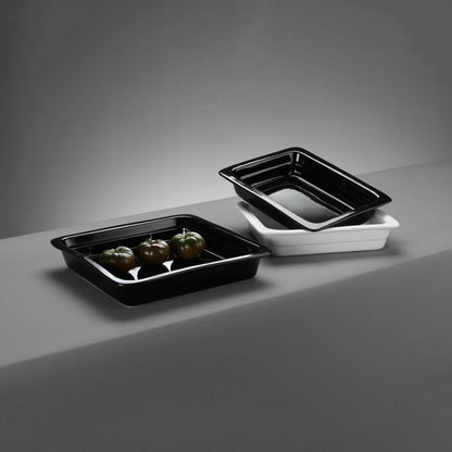 Black porcelain GN 1/1 container from Fine Dine with dimensions 525x320x68mm, showcasing a sleek, durable food storage solution.