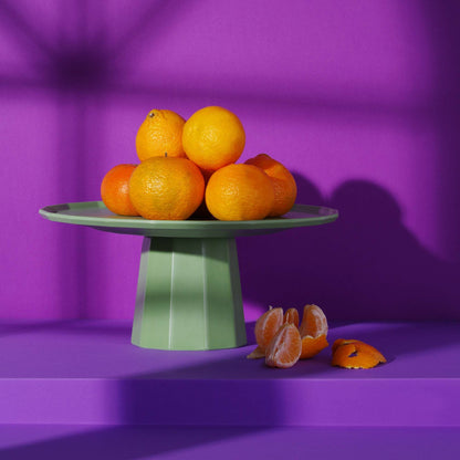 Green Fine Dine Metropolis fruit stand platter, 300mm, with a sleek, modern design perfect for serving fruits.